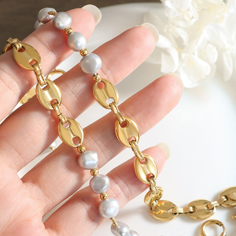 gold pearl chain bracelet in girls hand