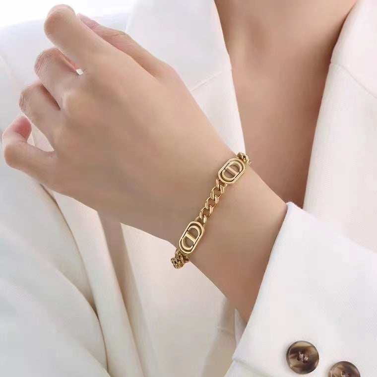 CD Cuban link chain bracelet on girls wrist