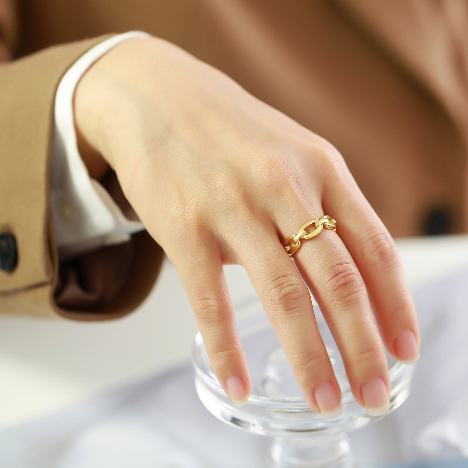 Chain ring on girls middle finger