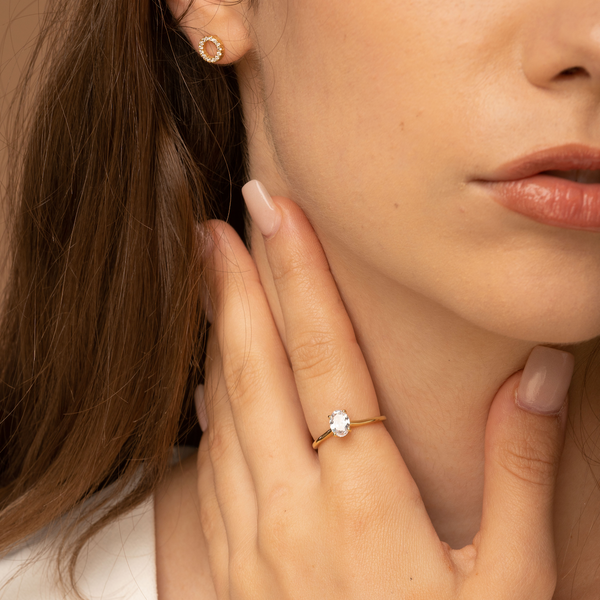 Crystal ring on girls index finger