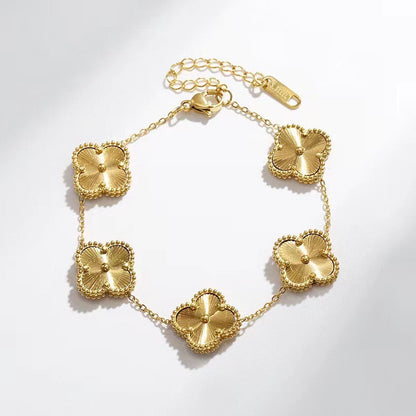 Stainless Steel Gold clover bracelet, white background