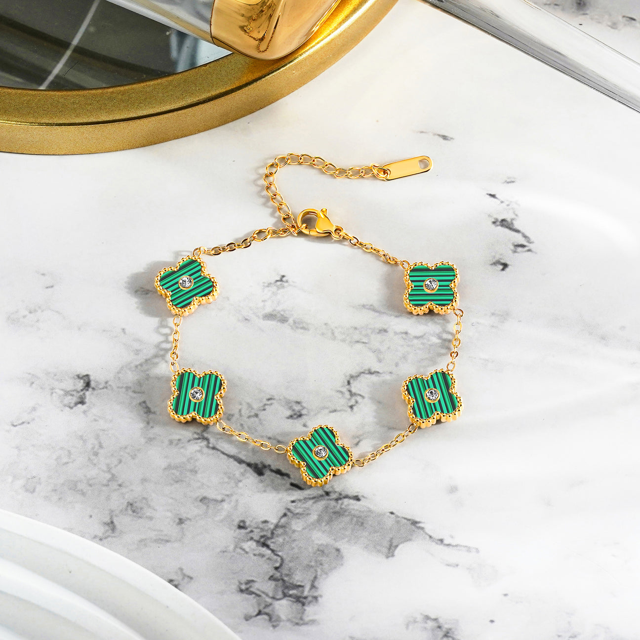 Green Four Leaf Clover Bracelet with Crystals on surface