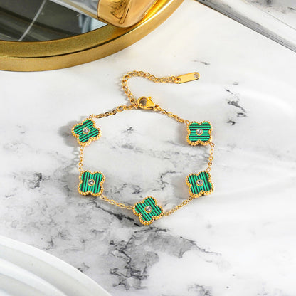 Green Four Leaf Clover Bracelet with Crystals on surface
