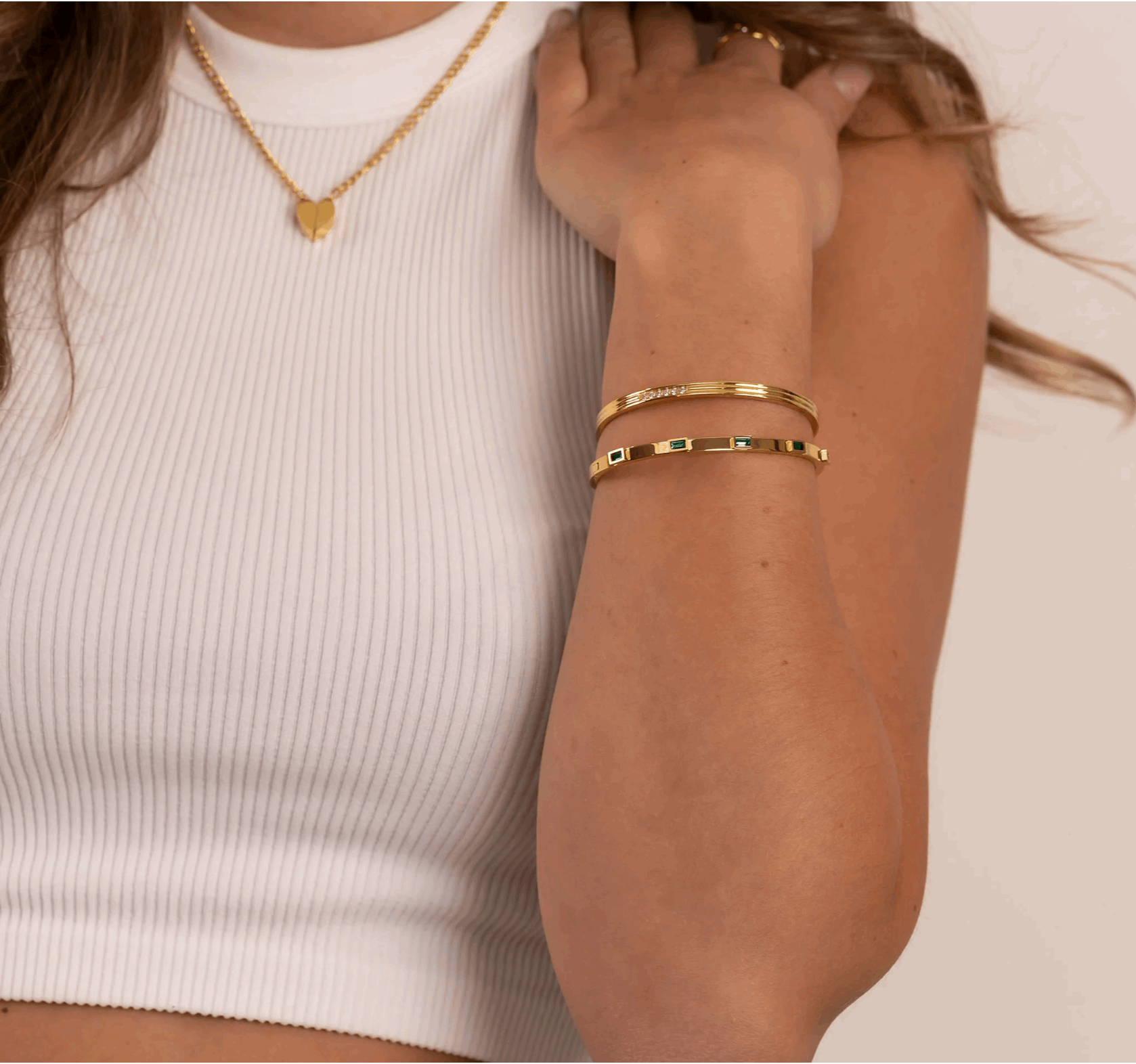 Mia's Gold Crystal Bracelet on raised arm