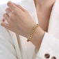 CD Cuban link chain bracelet on girls wrist