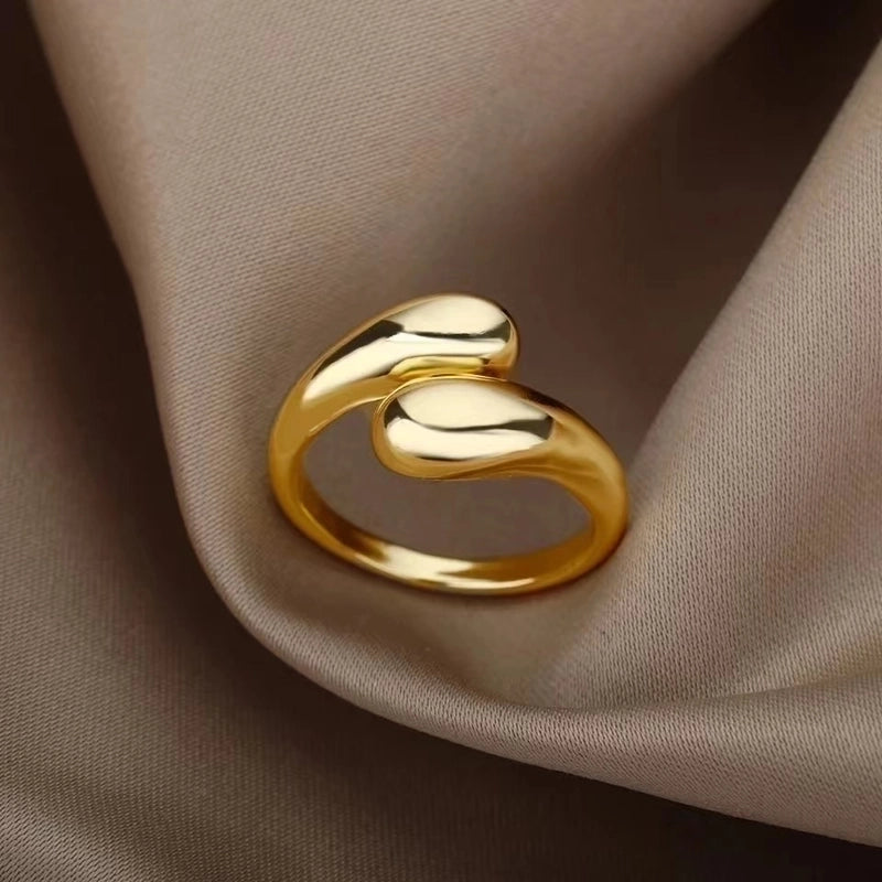 Gold hug ring on soft fabric